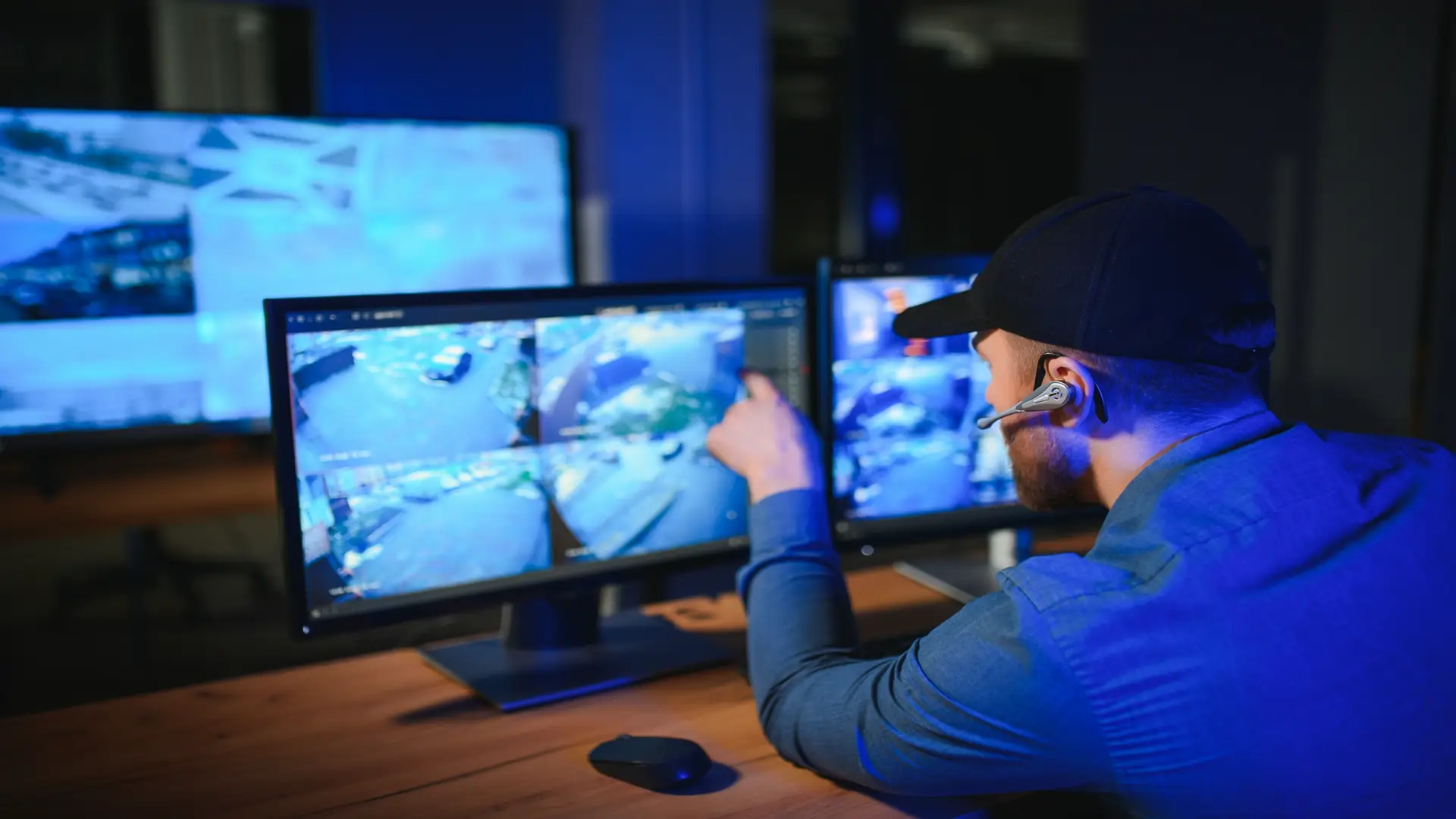 Security system operator looking at monitors