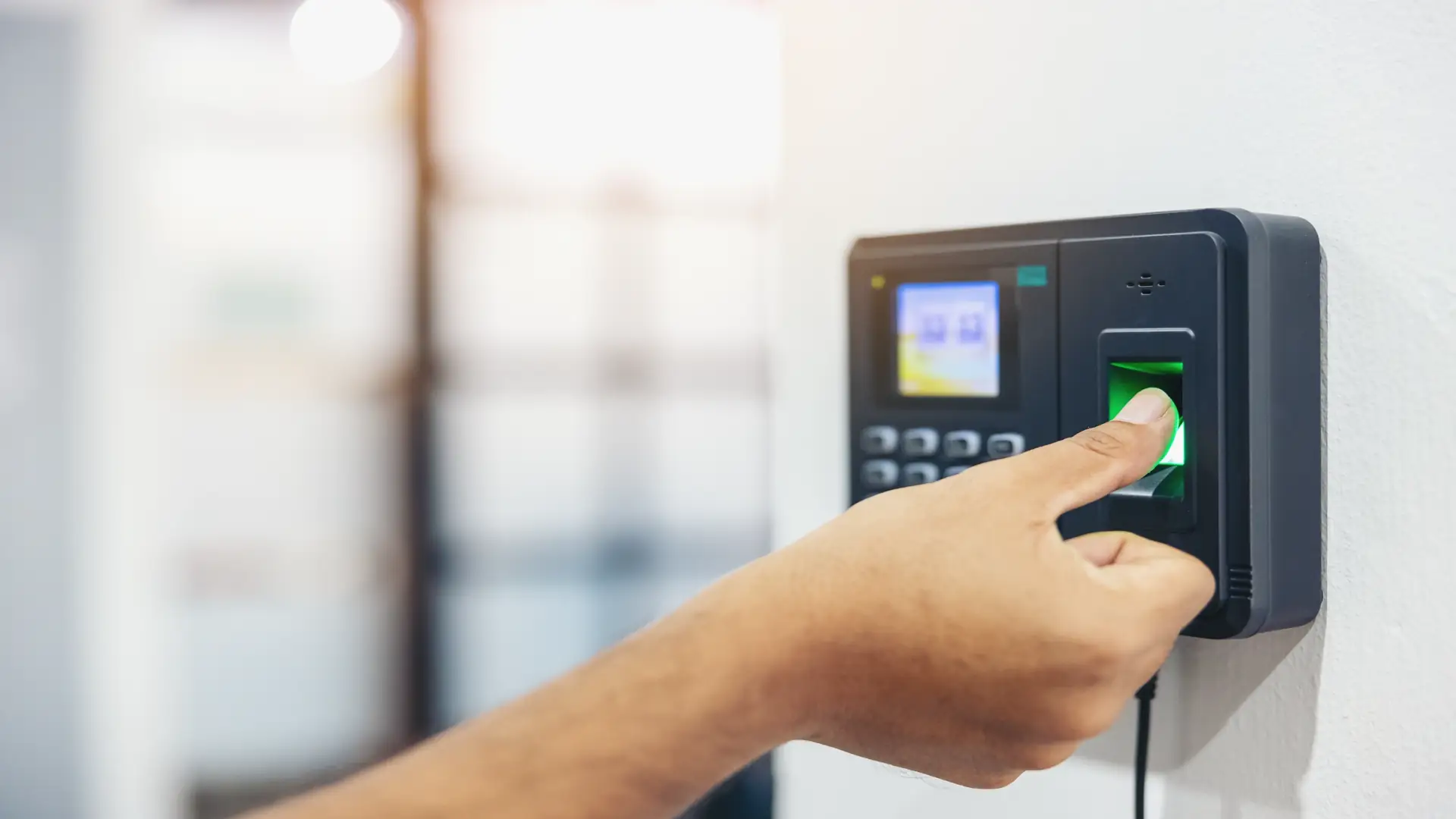 Employees using fingerprint scan biometric sensors