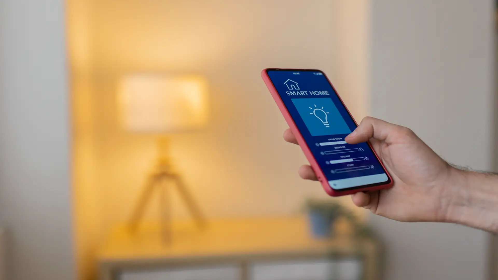 Man controlling smart home lighting with mobile app