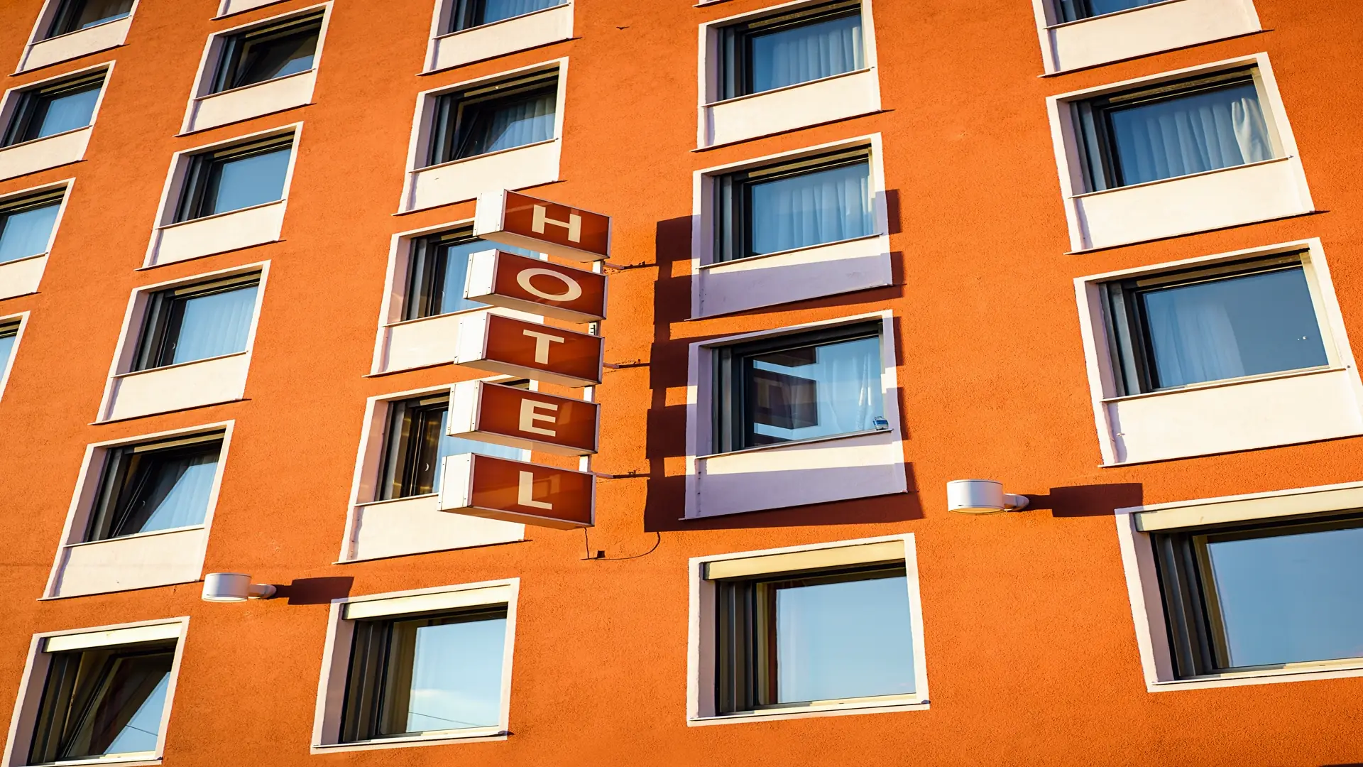 Electric hotel sign on building exterior