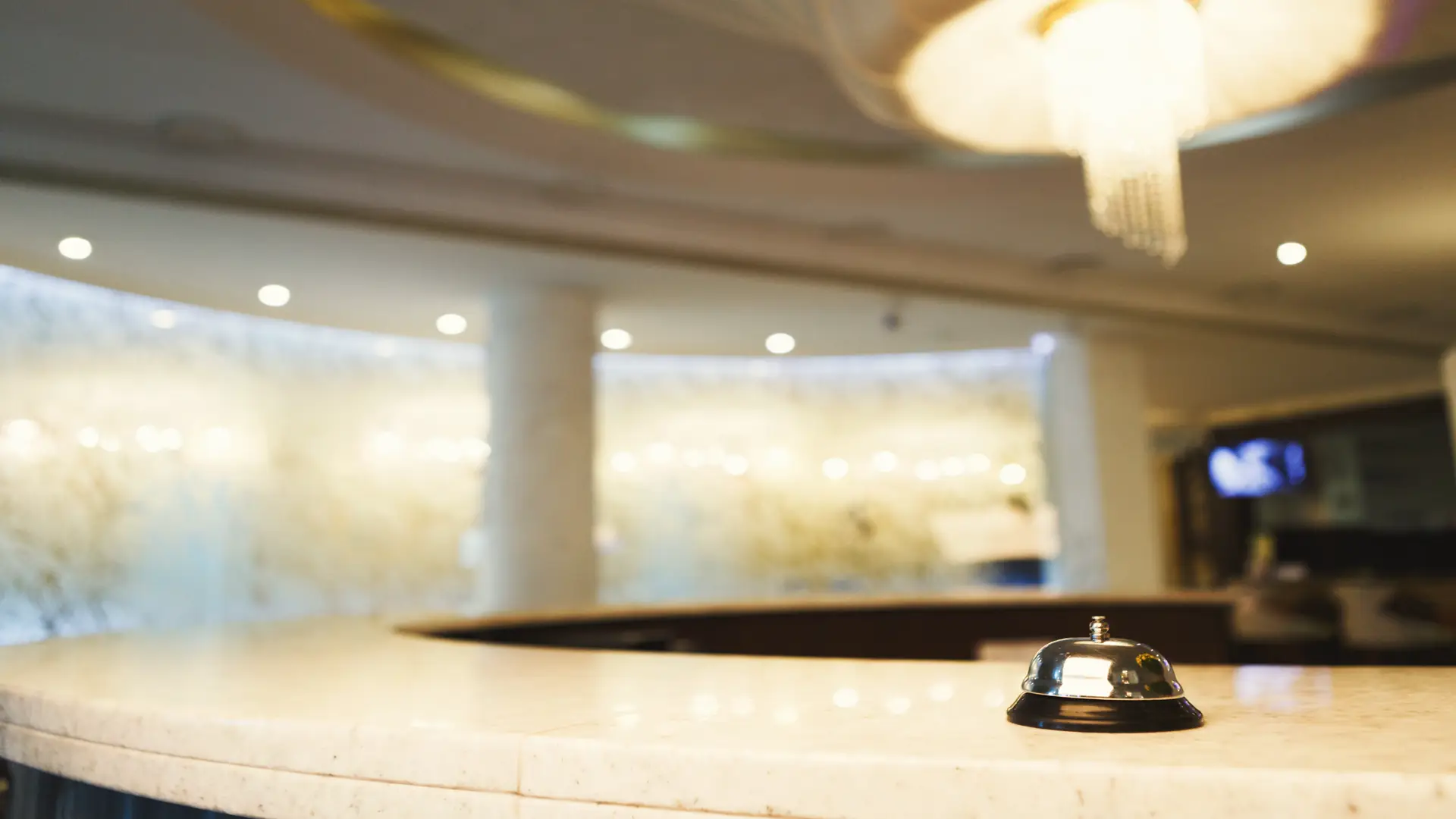 Hotel reception desk with bell