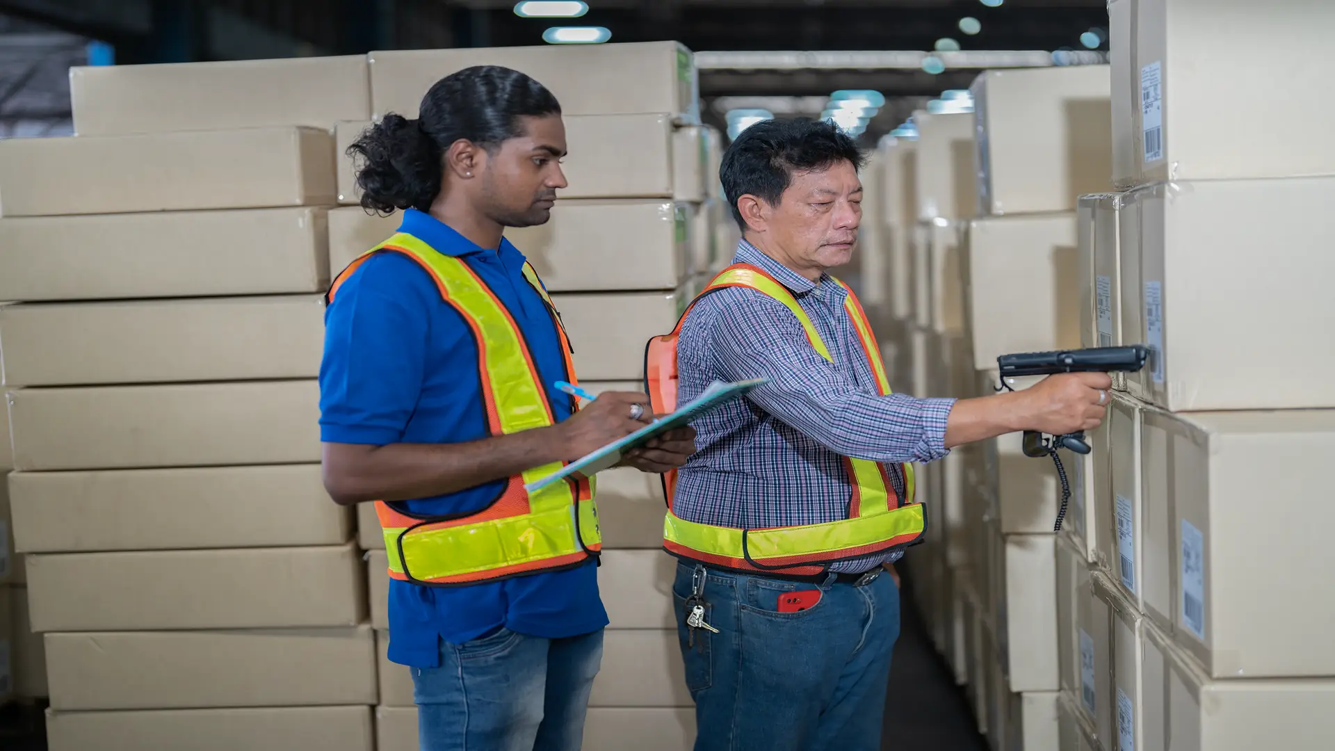 Manager and staff team working in warehouse