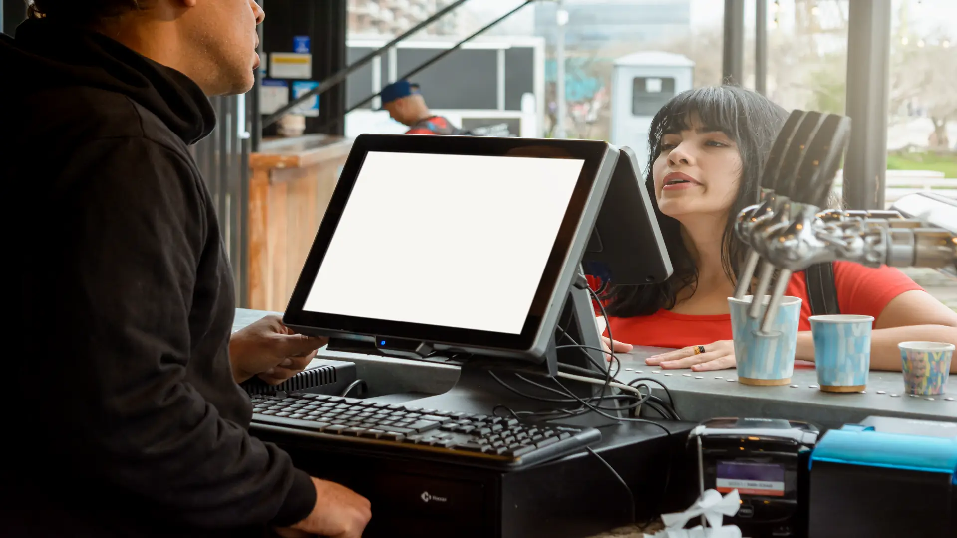 Woman ordering food at fast food restaurant