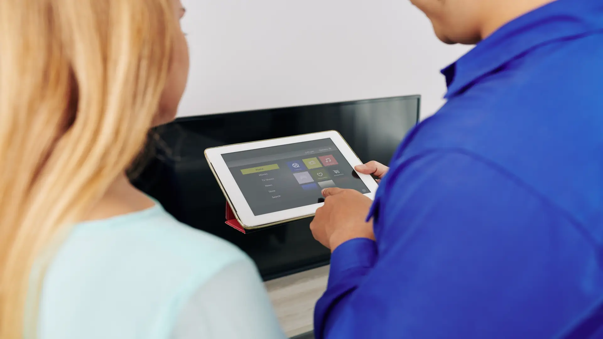 Technician showing smart home alarm app on smartphone