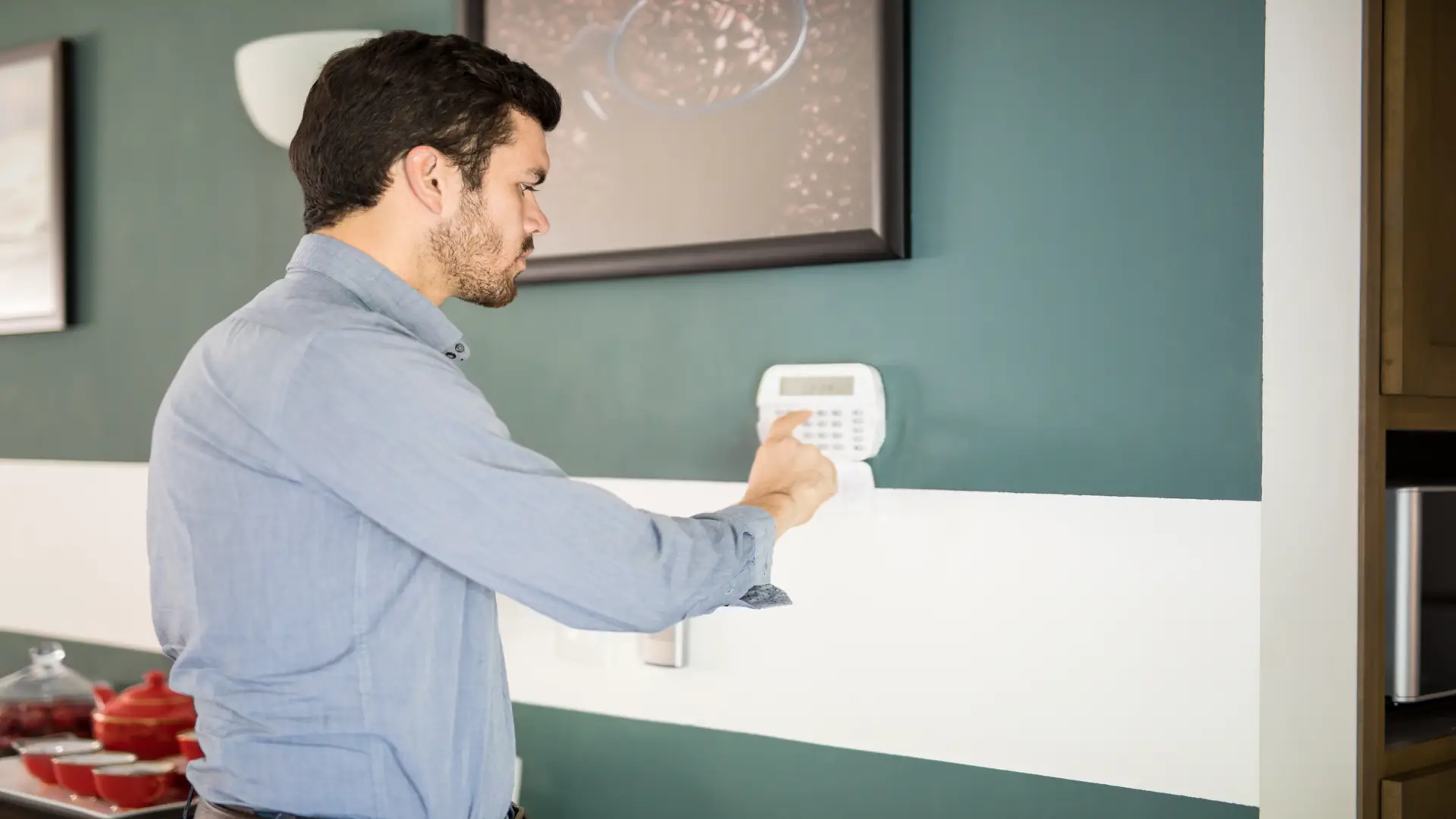 General Home Systems technician installing smart alarm system in GTA home